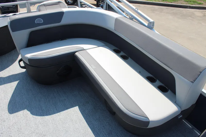 Slide: The Image of 2026 Sun Tracker Bass Buggy 18 DLX boat seating with cup holders, gray upholstery. - 10