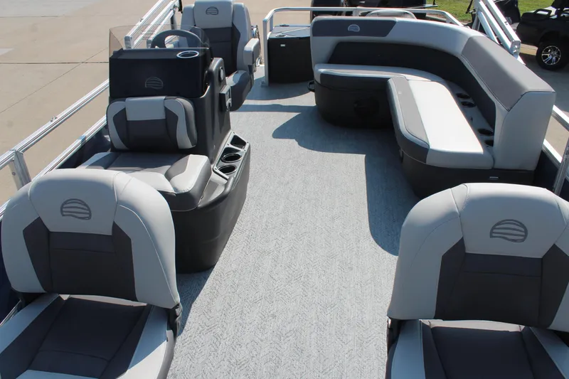 Slide: The Image of 2026 Sun Tracker Bass Buggy 18 DLX pontoon boat interior with spacious seating and modern design. - 7