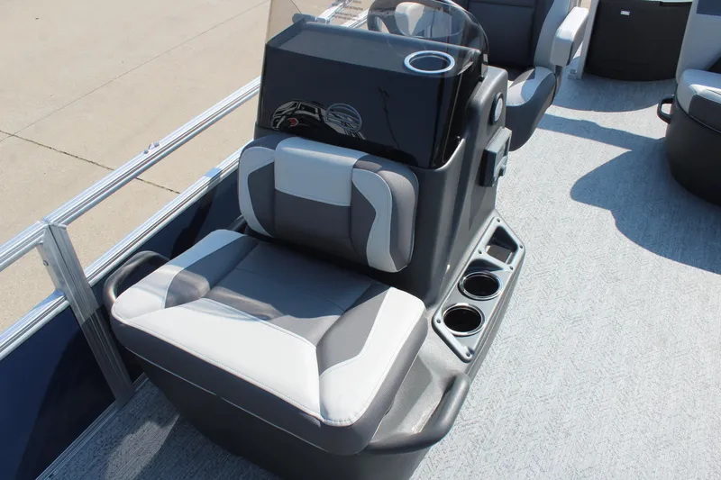 Slide: The Image of 2026 Sun Tracker Bass Buggy 18 DLX boat interior with seating and cup holders. - 8