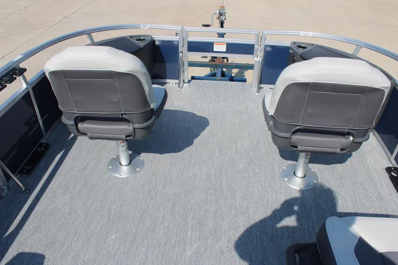 Slide: The Image of 2026 Sun Tracker Bass Buggy 18 DLX pontoon boat with two swivel seats on deck. - 9