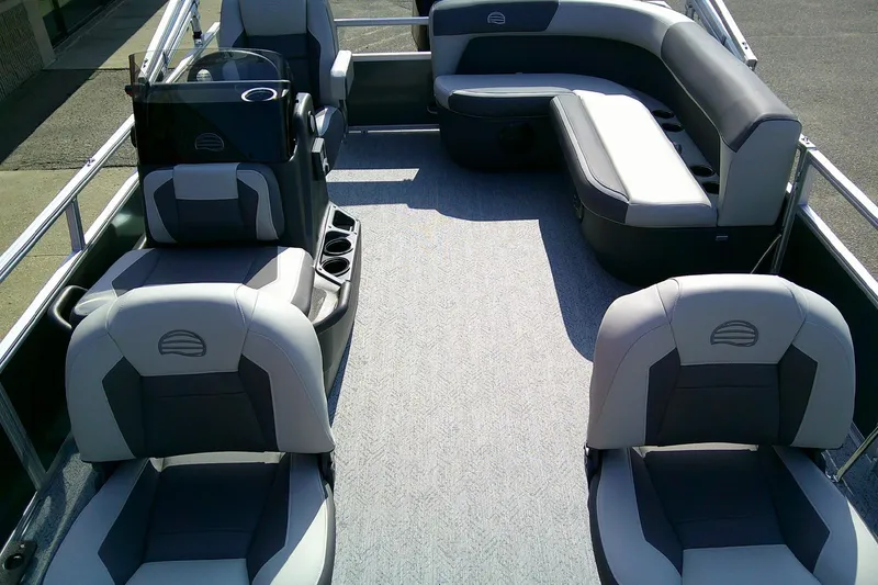 Slide: The Image of 2026 Sun Tracker Bass Buggy 16 XL Select pontoon boat interior with seating and helm. - 6
