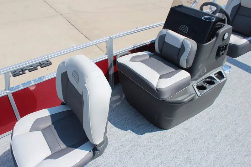 Slide: The Image of 2026 Sun Tracker Bass Buggy 18 DLX boat seats with console and cup holders. - 10