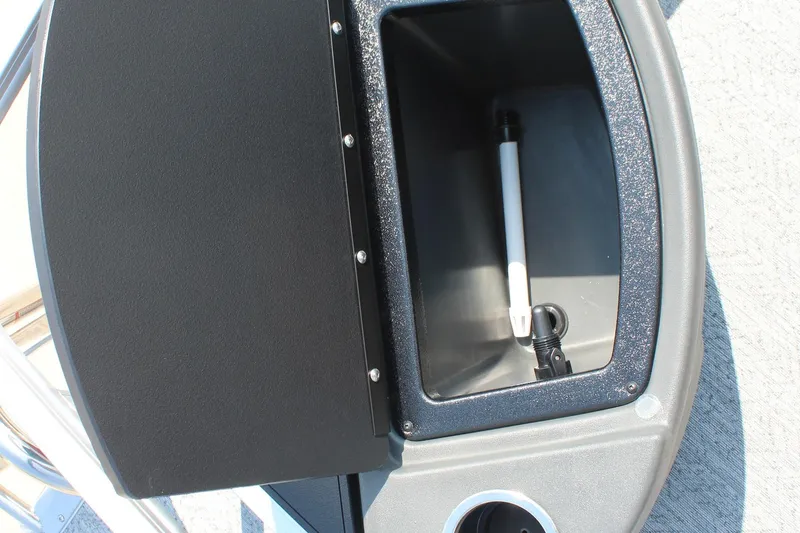 Slide: The Image of Storage compartment on 2026 Sun Tracker Bass Buggy 18 DLX boat, featuring a cup holder. - 19