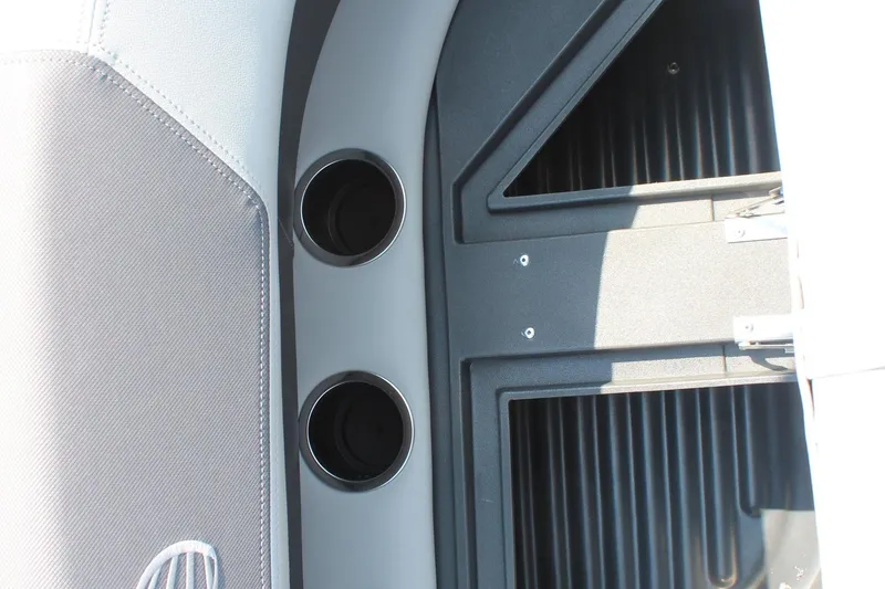 Slide: The Image of Interior of 2026 Sun Tracker Bass Buggy 18 DLX with cup holders and storage compartments. - 20