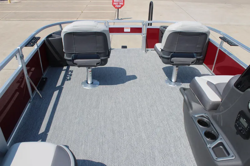 Slide: The Image of 2026 Sun Tracker Bass Buggy 18 DLX pontoon boat interior with seating and console. - 22