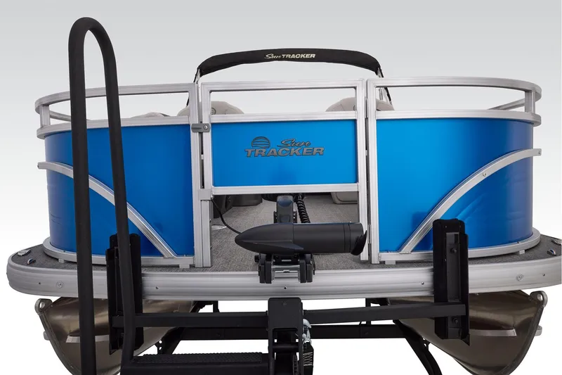 Slide: The Image of 2026 Sun Tracker Fishin' Barge 20 DLX interior with seating and storage compartment. - 20