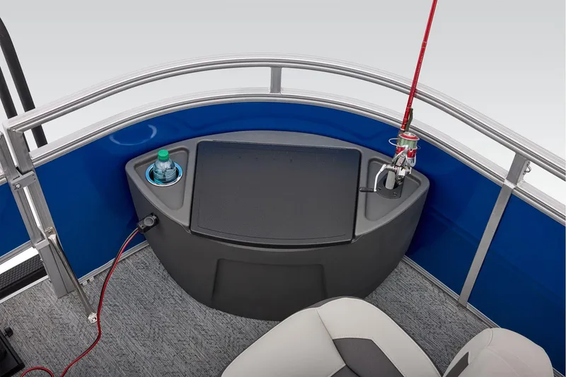 Slide: The Image of 2026 Sun Tracker Fishin' Barge 20 DLX interior with cup holders and cushioned seating. - 28