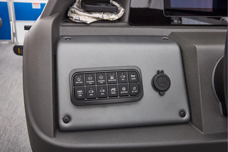 Slide: The Image of 2026 Sun Tracker Fishin' Barge 20 DLX fishing station with ruler and cup holders. - 43