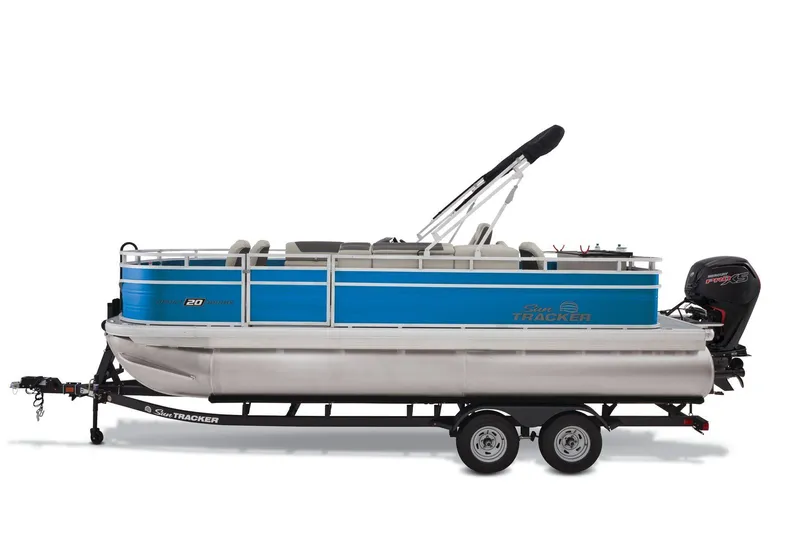 Slide: The Image of 2026 Sun Tracker Fishin' Barge 20 DLX pontoon boat with Mercury engine, parked outdoors. - 6