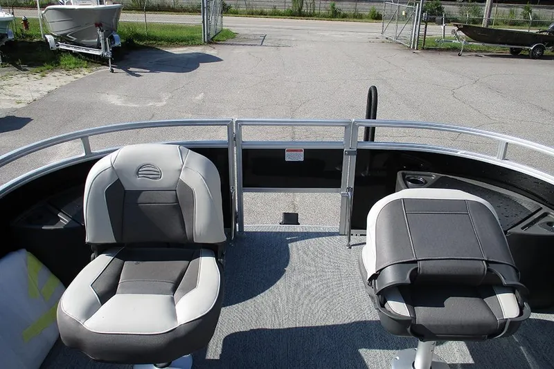 Slide: The Image of 2026 Sun Tracker Fishin' Barge 20 DLX boat interior with two seats. - 10