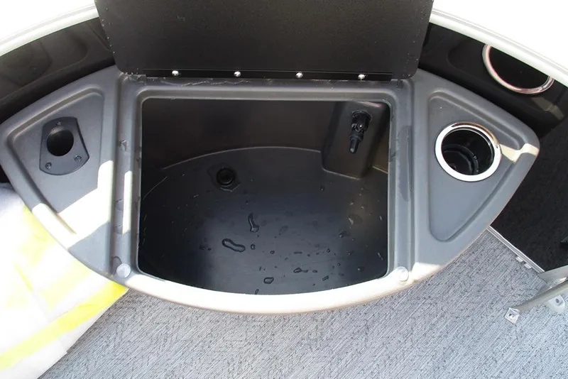 Slide: The Image of 2026 Sun Tracker Fishin' Barge 20 DLX livewell with cup holder and storage compartments. - 13