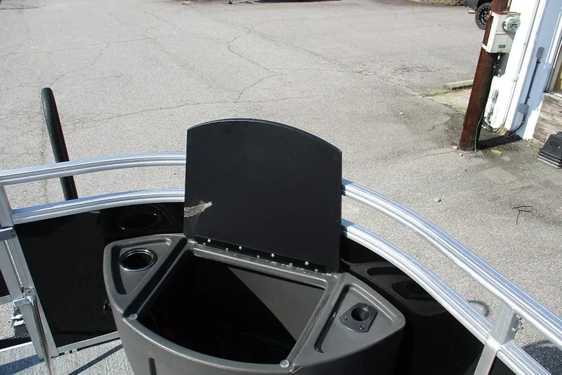 Slide: The Image of 2026 Sun Tracker Fishin' Barge 20 DLX boat console with cup holders and storage. - 14