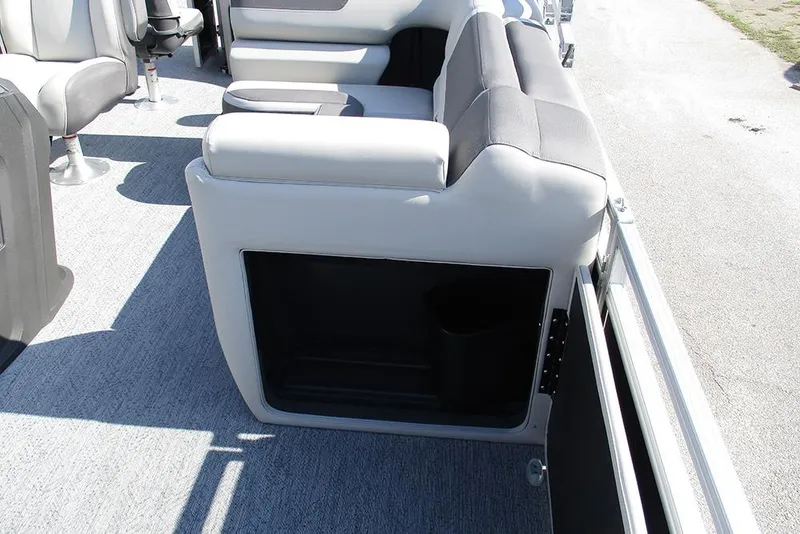 Slide: The Image of 2026 Sun Tracker Fishin' Barge 20 DLX interior seating and storage compartment. - 23