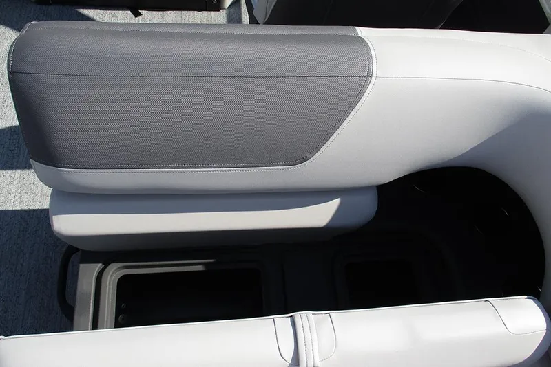 Slide: The Image of 2026 Sun Tracker Fishin' Barge 20 DLX seat with storage compartment, gray upholstery. - 28