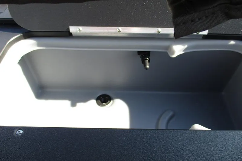 Slide: The Image of 2026 Sun Tracker Fishin' Barge 20 DLX livewell interior, featuring a clean, spacious design. - 31