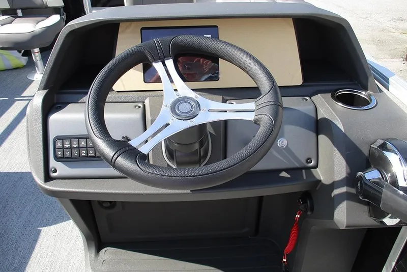 Slide: The Image of Steering console of 2026 Sun Tracker Fishin' Barge 20 DLX with modern controls. - 35