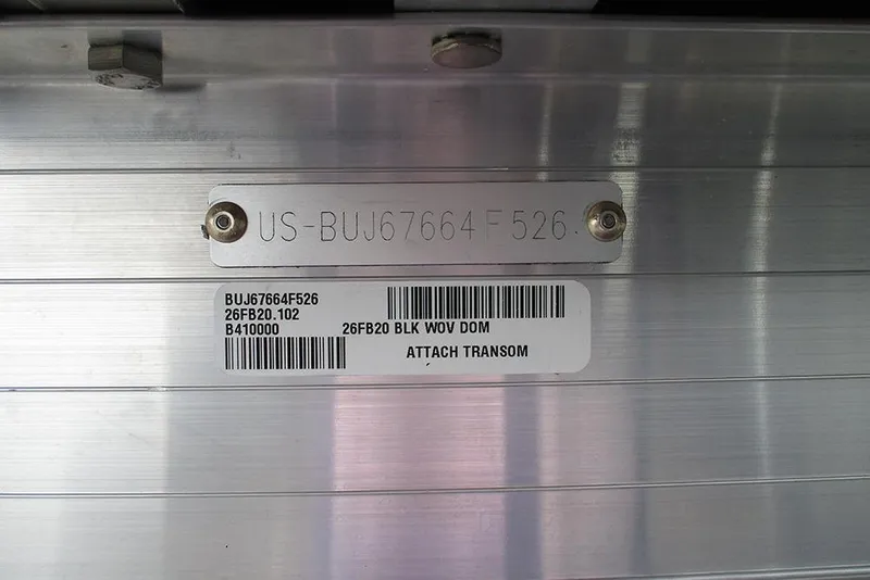 Slide: The Image of 2026 Sun Tracker Fishin' Barge 20 DLX transom with identification plate and barcode. - 37