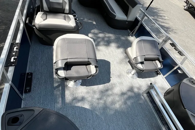 Slide: The Image of 2026 Sun Tracker Bass Buggy 18 DLX interior with gray seating and spacious layout. - 8