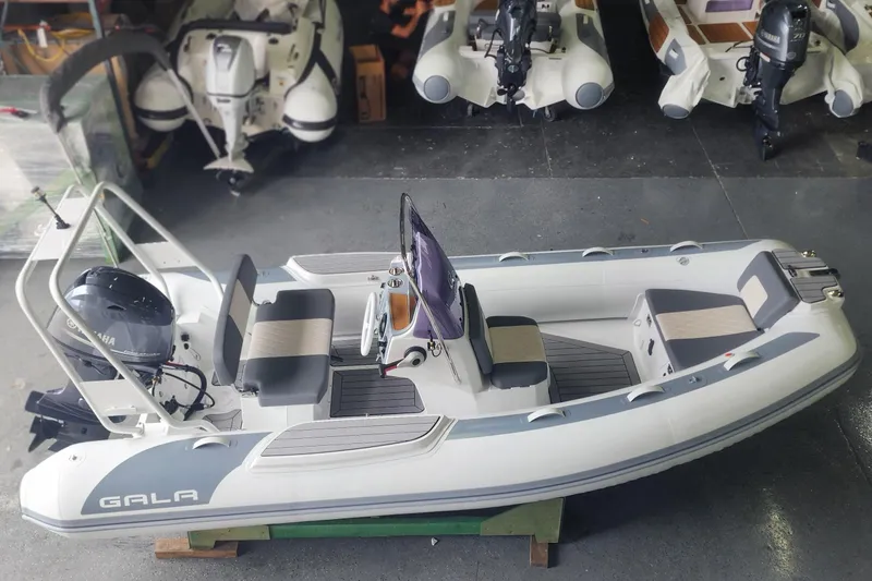 The Image of 2026 Gala A450L inflatable boat with Yamaha engine in showroom. - 1