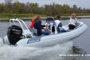Slide: The Image of 2026 Gala A450HL boat with Tohatsu 60HP engine cruising on a calm river. - 12