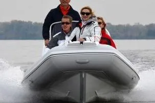 Slide: The Image of Four people enjoying a ride on a 2026 Gala A450HL boat with Tohatsu 60HP engine. - 13