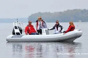 Slide: The Image of 2026 Gala A450HL boat with Tohatsu 60HP engine on calm water, four people onboard. - 14
