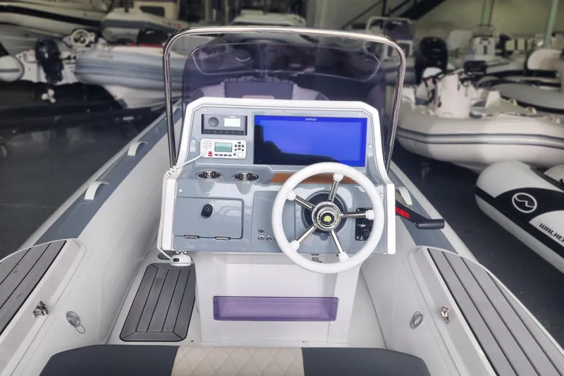Slide: The Image of 2026 Gala A450L boat dashboard with steering wheel and navigation display in showroom. - 4