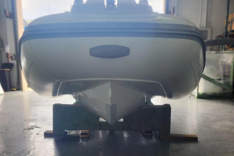 Slide: The Image of 2026 Gala A450L boat hull on display in a showroom. - 6