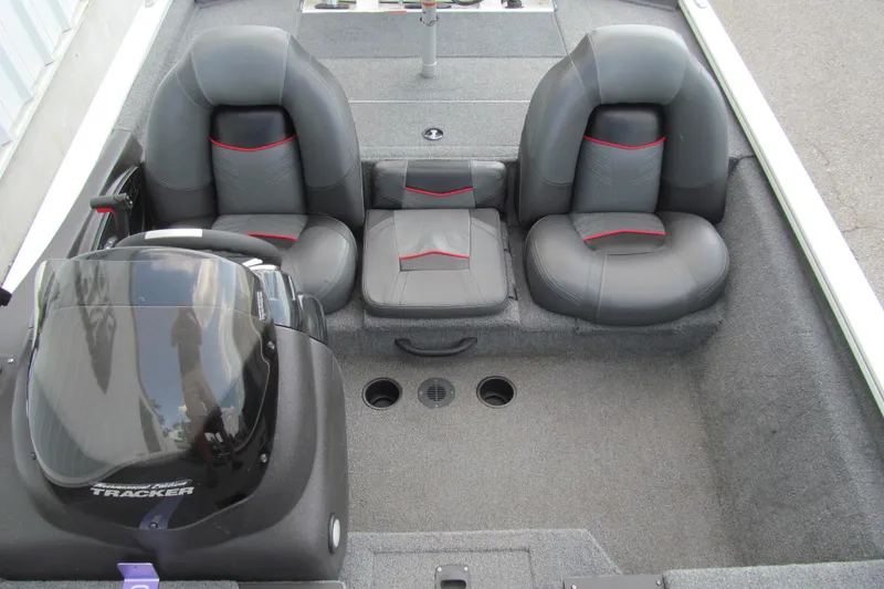 Slide: The Image of 2023 Tracker Pro Team 175 TXW Tournament Edition boat interior with three gray seats. - 11