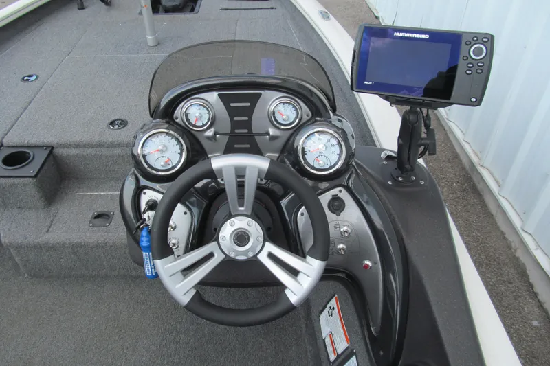 Slide: The Image of 2023 Tracker Pro Team 175 TXW Tournament Edition boat dashboard with steering wheel and gauges. - 6