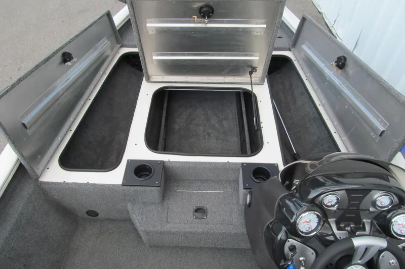 Slide: The Image of 2023 Tracker Pro Team 175 TXW Tournament Edition boat interior with open storage compartments. - 8