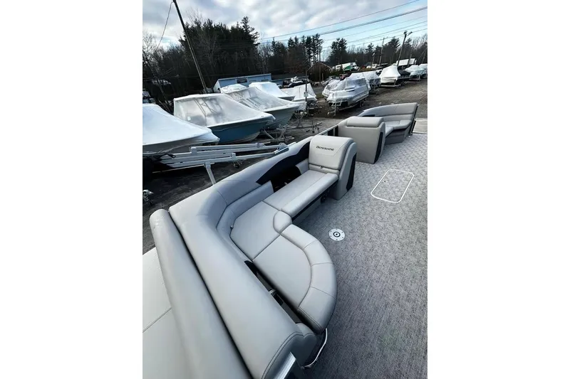 Slide: The Image of 2025 Berkshire 22CL2 LE pontoon boat with gray seating and carpeted deck. - 4