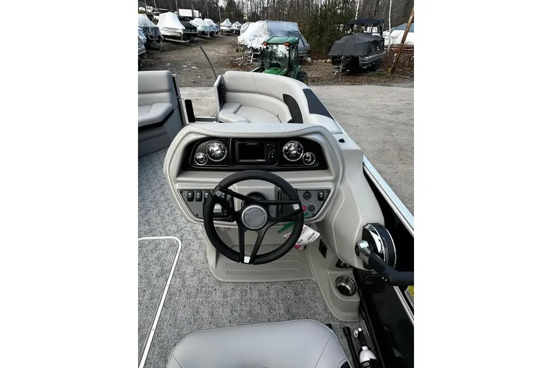 Slide: The Image of 2025 Berkshire 22CL2 LE boat dashboard with steering wheel and controls. - 6