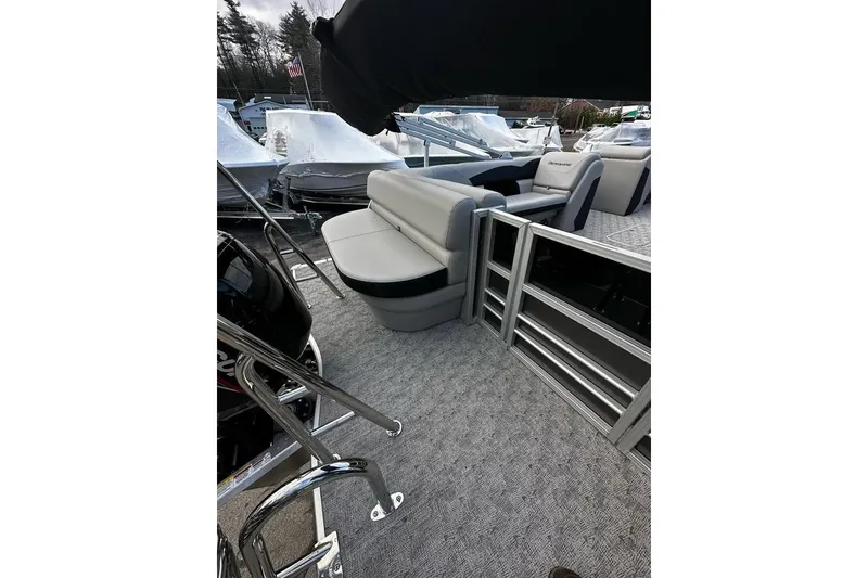 Slide: The Image of 2025 Berkshire 22CL2 LE pontoon boat interior with gray seating and carpeted flooring. - 8