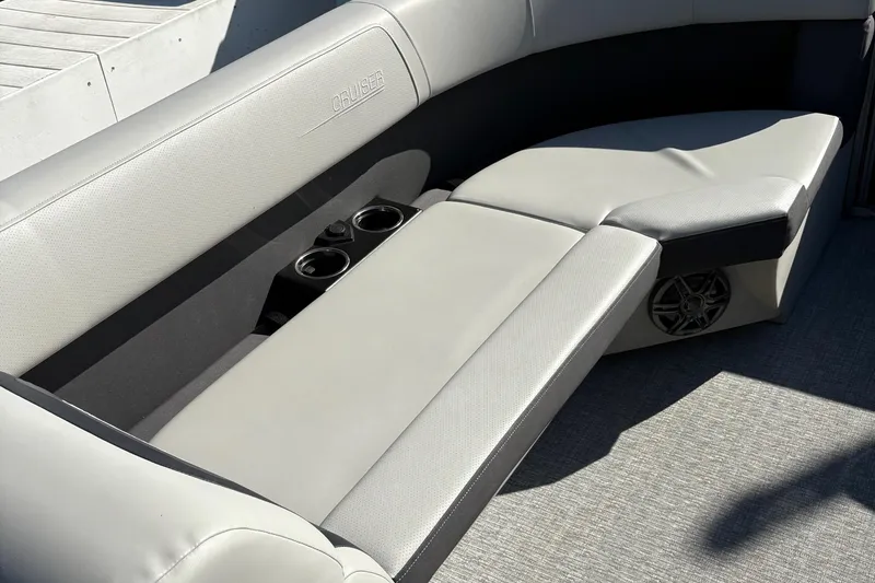 Slide: The Image of 2025 Harris Cruiser 230 boat interior with gray seating and cup holders. - 16