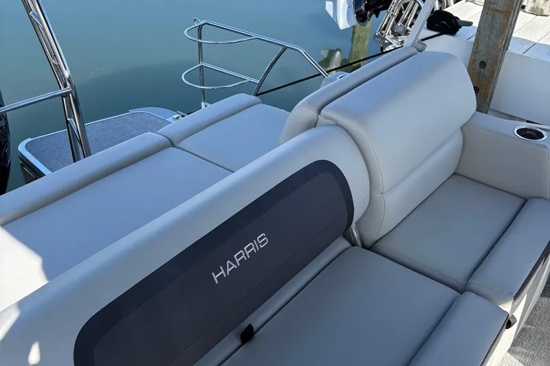 Slide: The Image of 2025 Harris Cruiser 230 boat interior with comfortable seating and sleek design. - 8