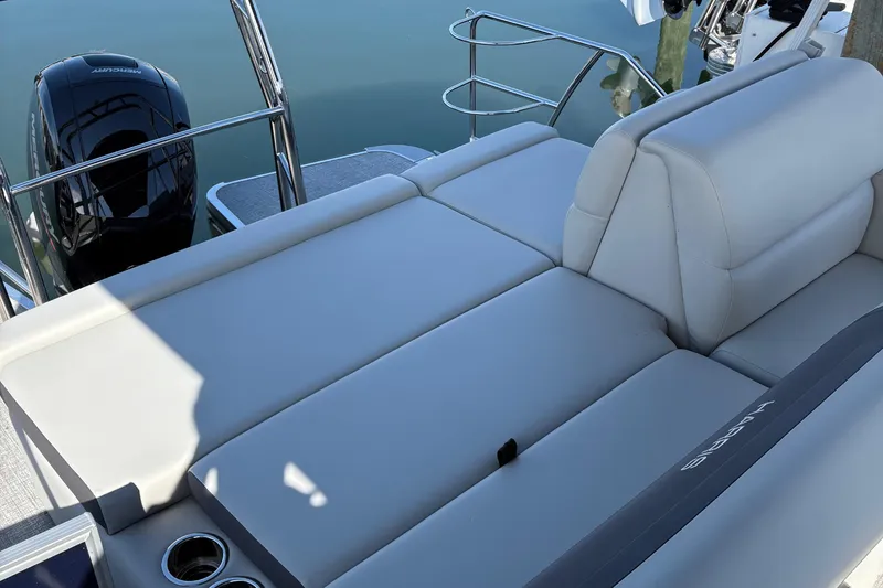 Slide: The Image of 2025 Harris Cruiser 230 boat with luxurious seating and sleek design. - 9