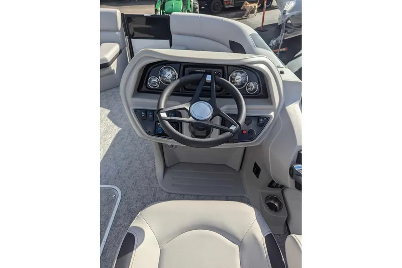Slide: The Image of 2025 Berkshire 22UL LE boat dashboard with steering wheel and control panel. - 13