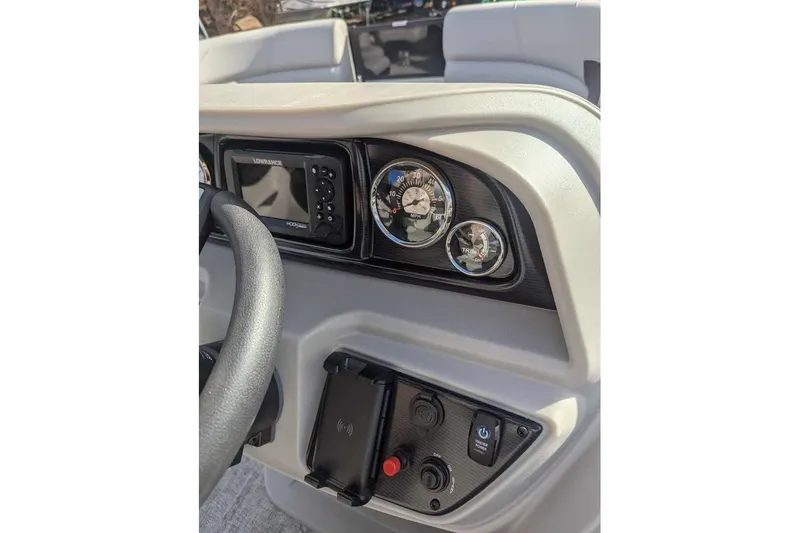 Slide: The Image of 2025 Berkshire 22UL LE dashboard with gauges and controls, featuring Lowrance display. - 15