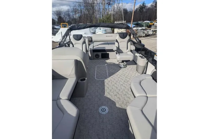 Slide: The Image of 2025 Berkshire 22UL LE pontoon boat interior with plush seating and modern design. - 7