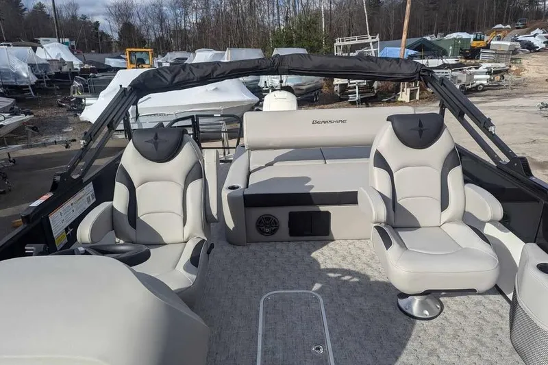 Slide: The Image of 2025 Berkshire 22UL LE pontoon boat interior with plush seating and modern design. - 8