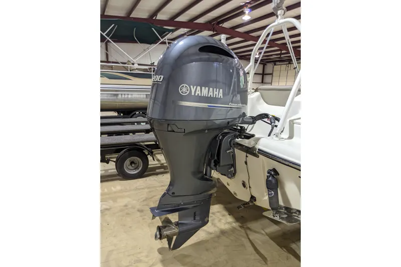 Slide: The Image of 2023 Key West 203 DFS boat with Yamaha outboard motor in indoor storage. - 19