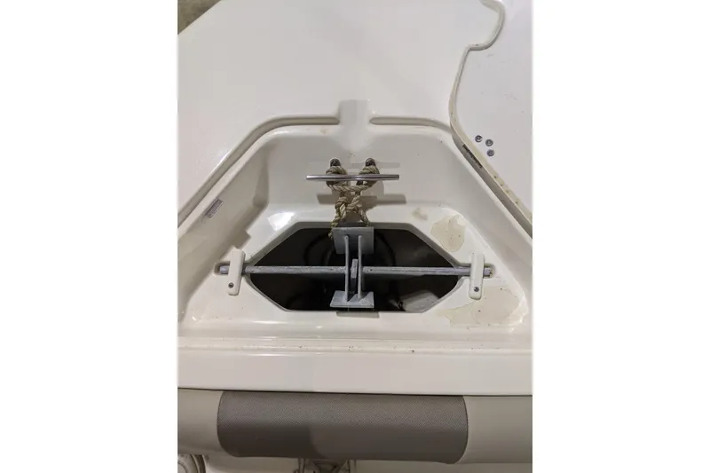 Slide: The Image of 2023 Key West 203 DFS boat anchor compartment with rope and cleat. - 20