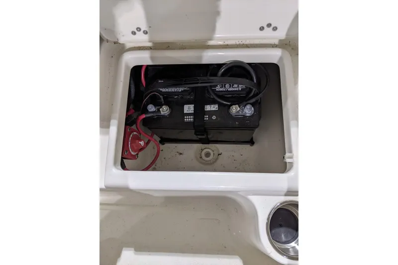 Slide: The Image of Battery compartment of 2023 Key West 203 DFS boat, featuring wiring and connections. - 21