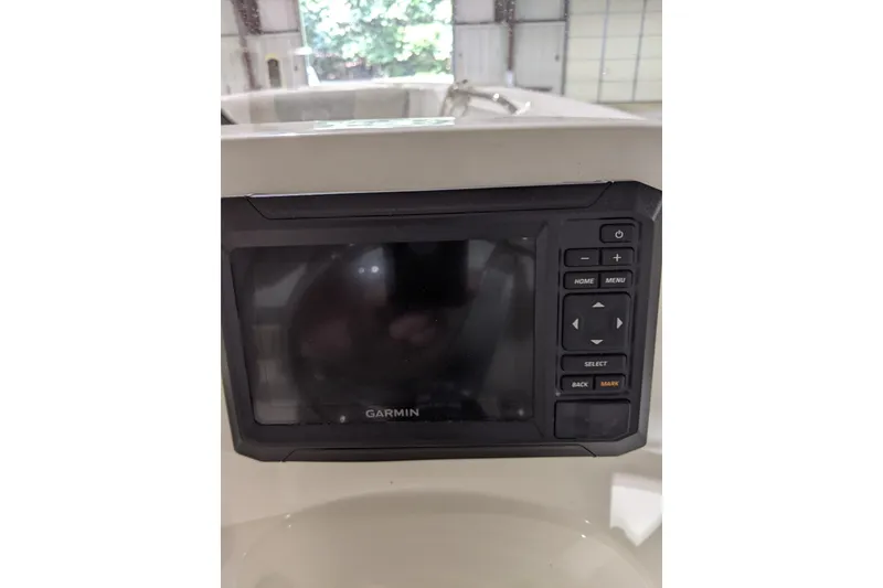 Slide: The Image of Garmin navigation system on 2023 Key West 203 DFS boat dashboard. - 22