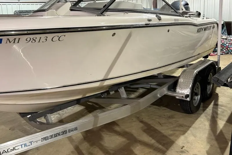 Slide: The Image of 2023 Key West 203 DFS boat on trailer in indoor storage. - 4