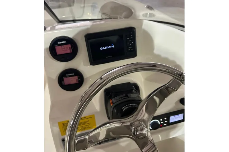 Slide: The Image of 2023 Key West 203 DFS boat dashboard with Garmin display and Yamaha gauges. - 7