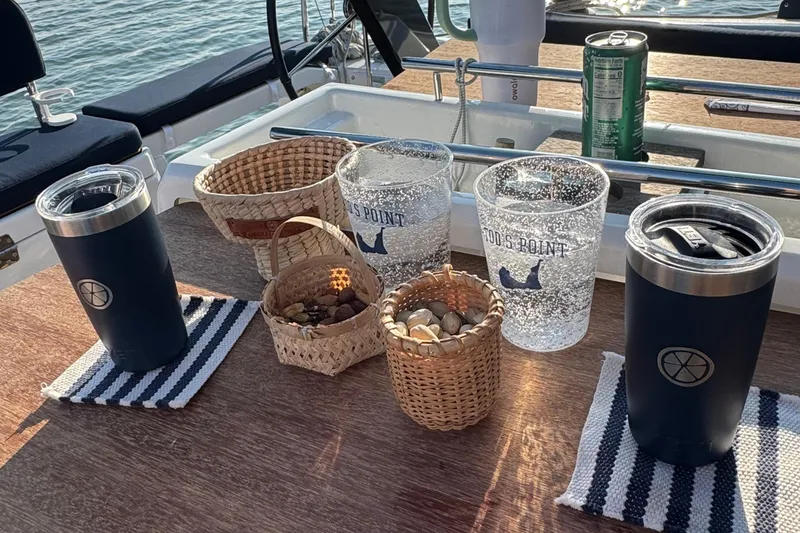 Slide: The Image of Outdoor table on 2023 Dufour 37 yacht with drinks and snacks. - 28