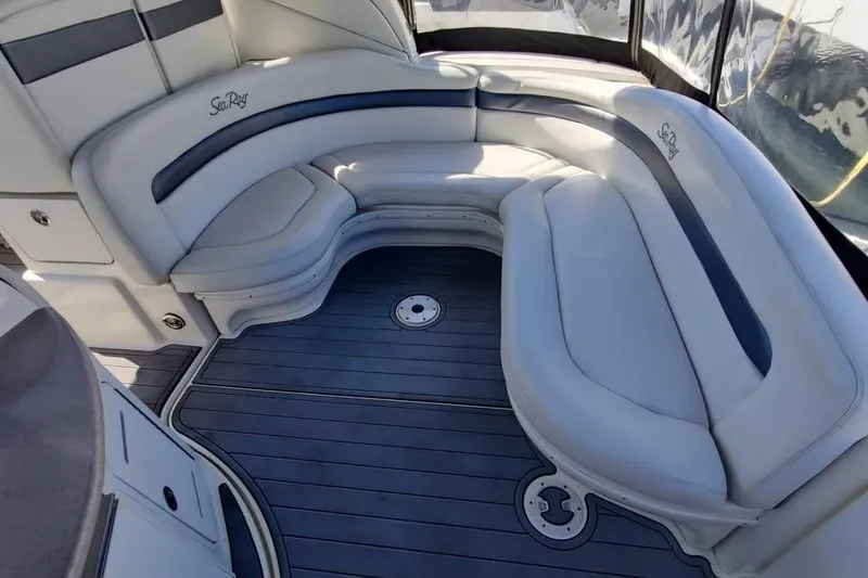 Slide: The Image of Luxurious seating area on a 2002 Sea Ray 320 Sundancer boat with sleek design. - 10