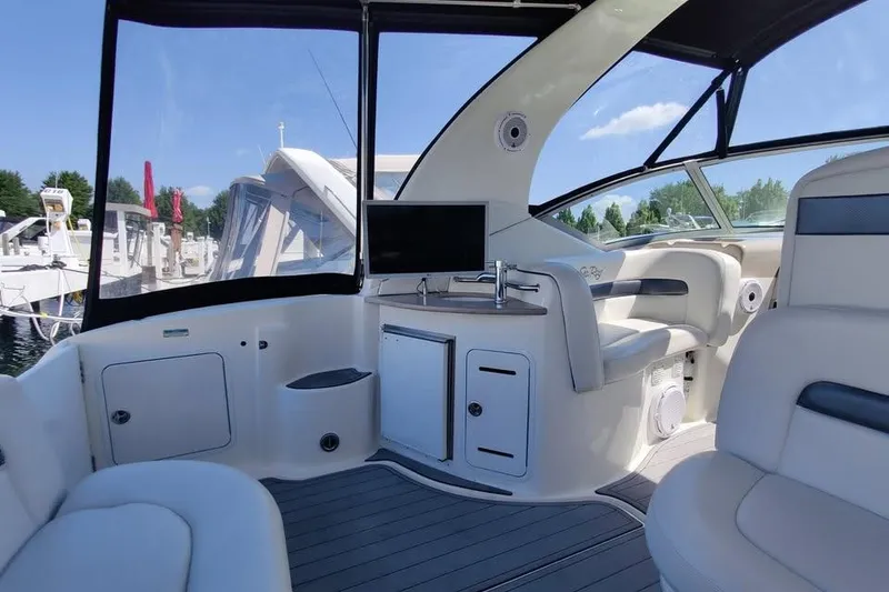 Slide: The Image of Interior of 2002 Sea Ray 320 Sundancer yacht with seating and kitchenette. - 11